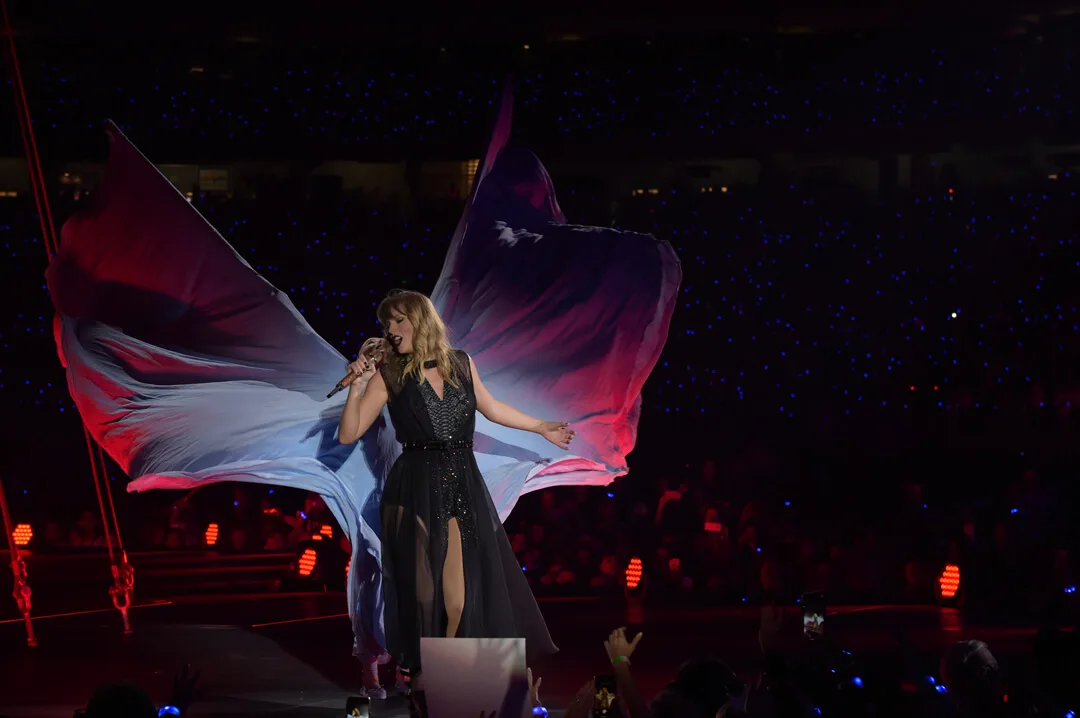 Fabric extends into a winglike stage gesture